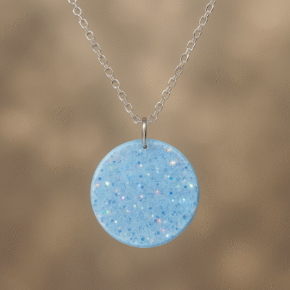Crystal Glow Circle Resin Necklace – Transparent Pendant with Blue Iridescent Glitter