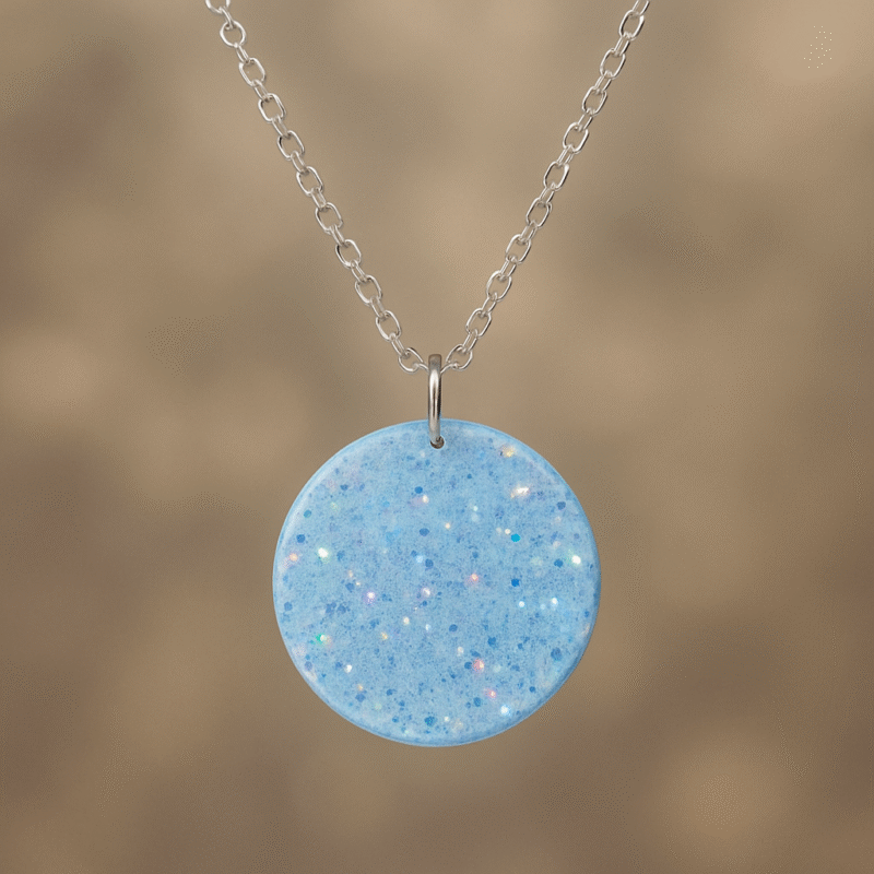 Crystal Glow Circle Resin Necklace – Transparent Pendant with Blue Iridescent Glitter