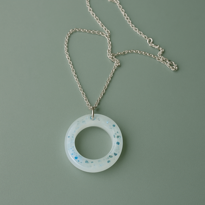 Frosted Halo Resin Necklace – Translucent Open Circle with Blue Glitter on Silver Chain